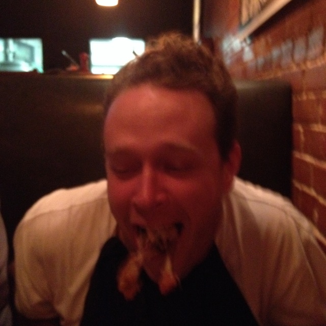 At the restaurant, I told Matt he still had some meat left on those chicken-wing bones. This is what he did in response.