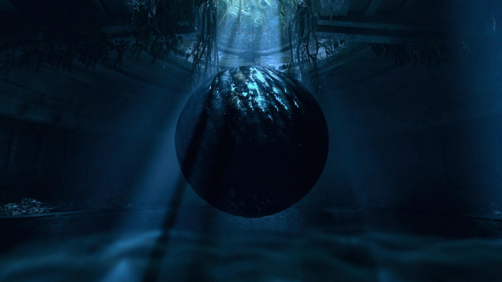 An eerie, floating black orb in a dark space, with light streaming onto it from above