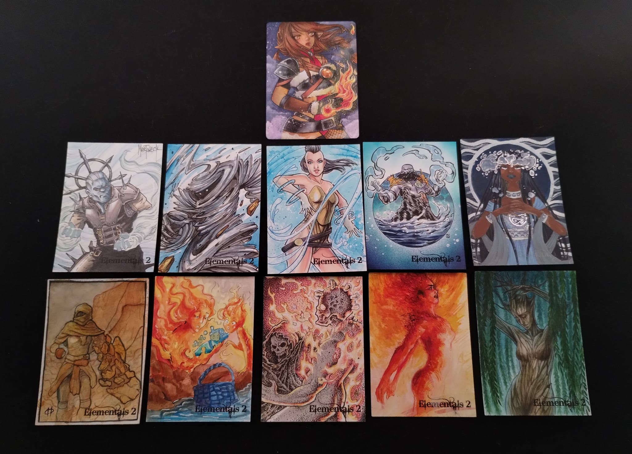 Eleven sketch cards arrayed side by side in rows