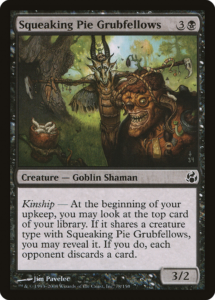 The Magic: The Gathering card, Squeaking Pie Grubfellows. It depicts two goblins standing at the near a clearing in a forest, looking at a cup full of insect grubs. The goblins are wearing leathery shamanic clothing, with a collection of trinkets attached to them.