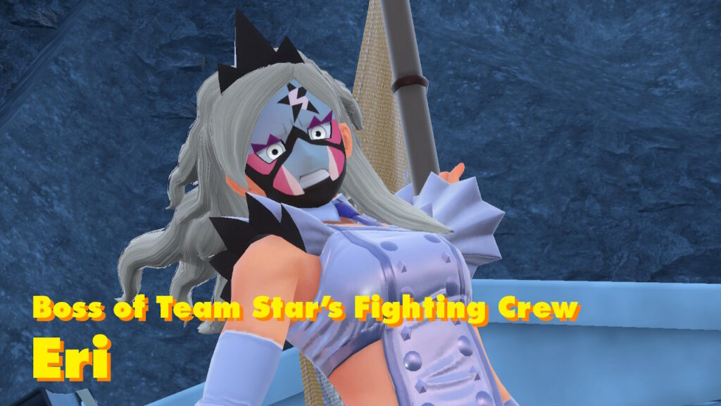 Eri, the boss of Team Star’s Fighting Crew. She’s a tall and well-muscled woman, whose outfit is a stylized white pleather dress - a femme aesthetic which clashes with her full face paint, whose jagged and edgy patterns match the expression of rage she’s wearing.