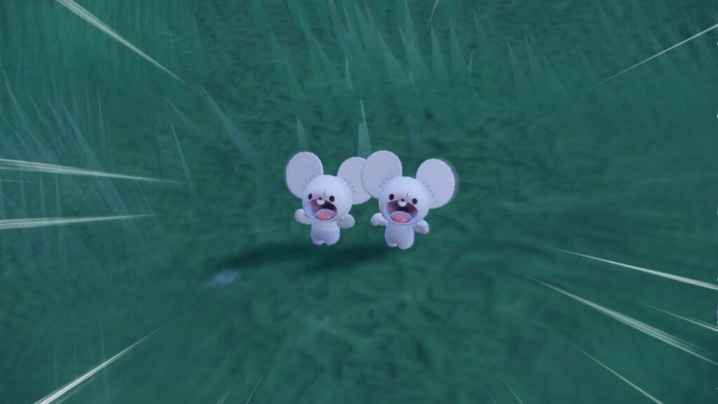 “Tandemaus, one of the new pokémon, which looks like a pair of white cartoon mice with round ears and simple facial features, standing in a patch of grass. Both of them are screaming, with their mouths in adorable and comically-large O-shapes taking up most of their faces.”