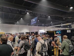 A long line of backpack-wearing convention-goers.