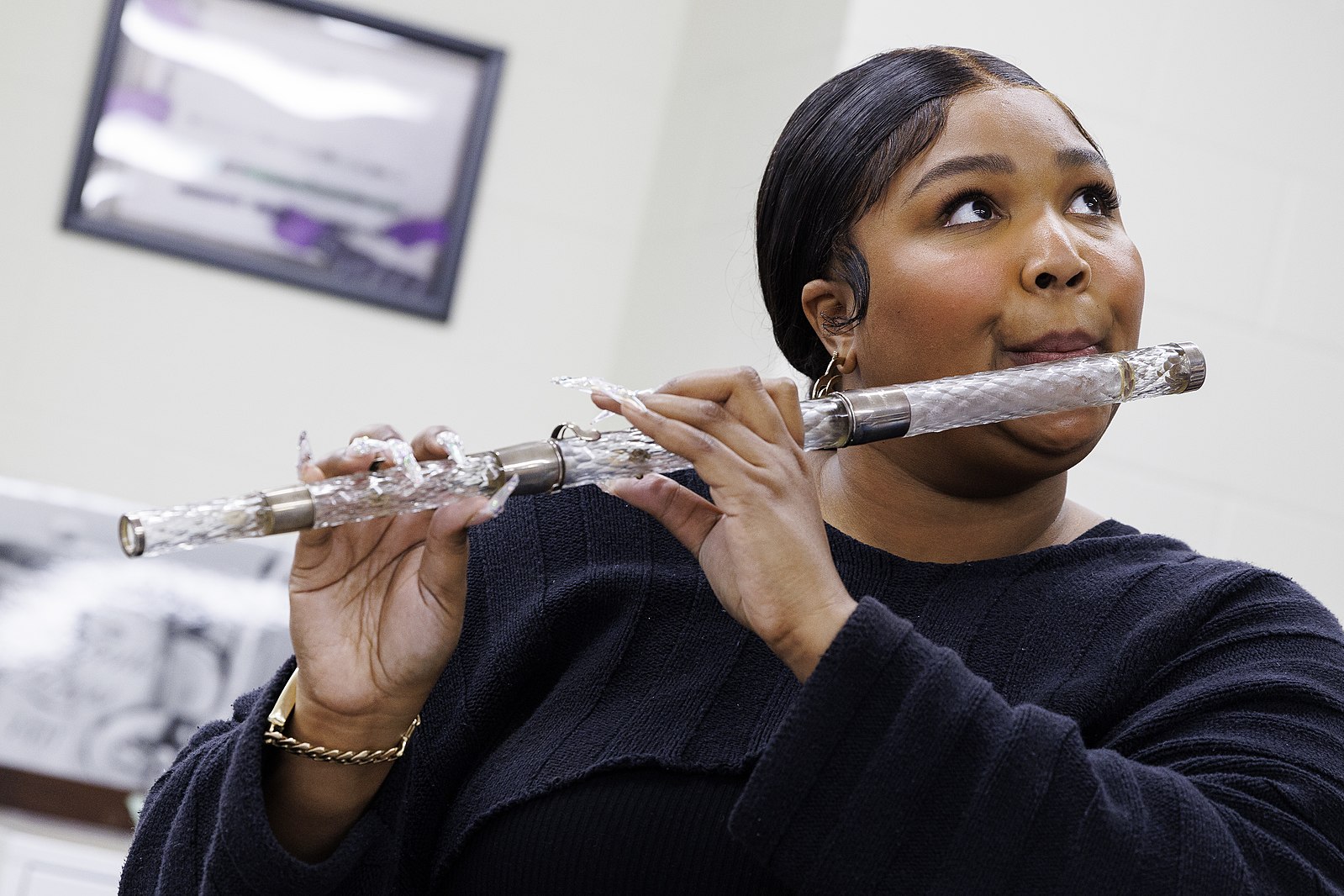 Lizzo plays President James Madison's 1813 crystal flute in the flute vault at the Library of Congress, September 26, 2022. Photo by Shawn Miller/Library of Congress. Privacy and publicity rights for individuals depicted may apply.