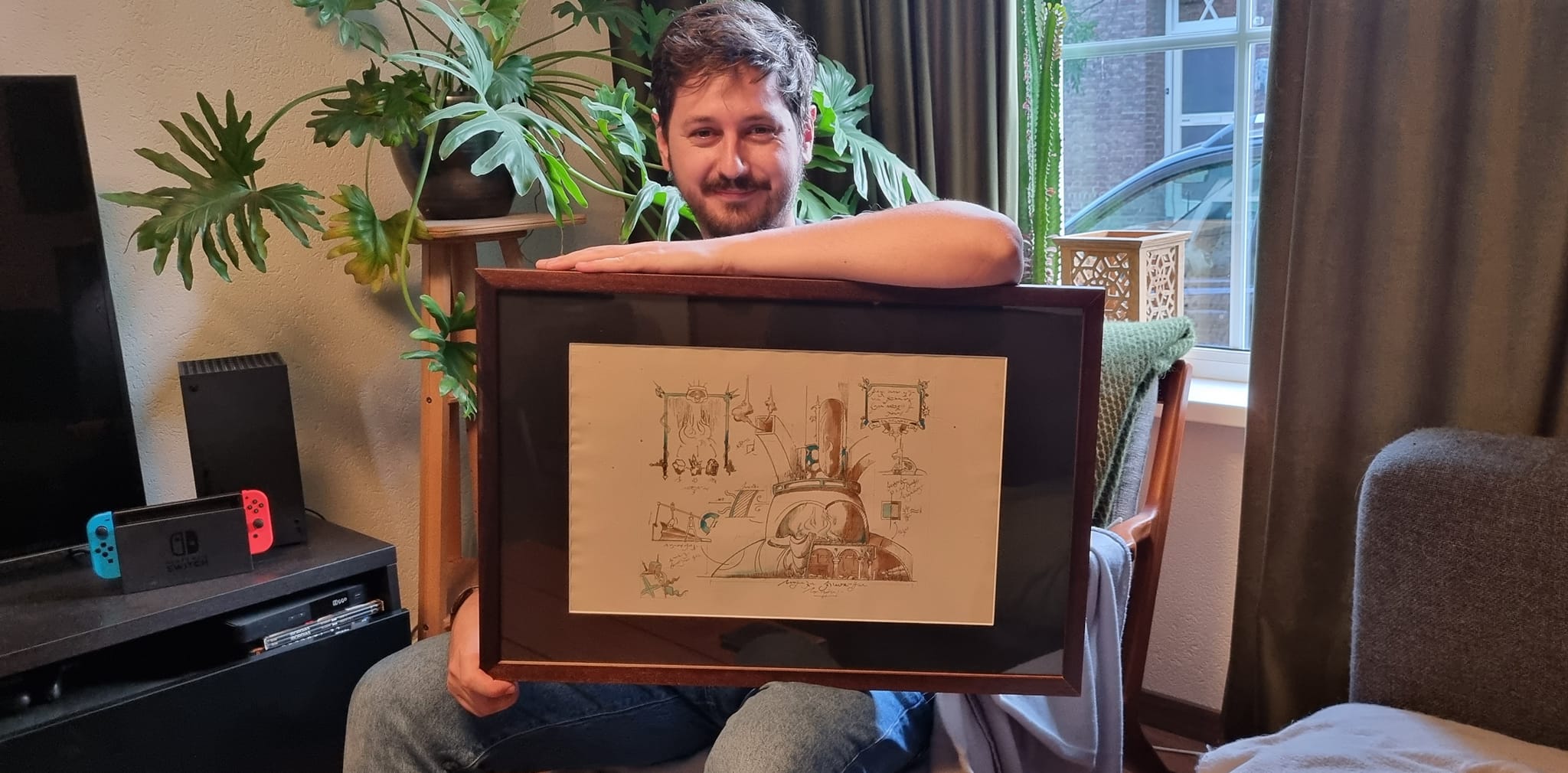 Titus Lunter posing with his Mystic Forge illustration.