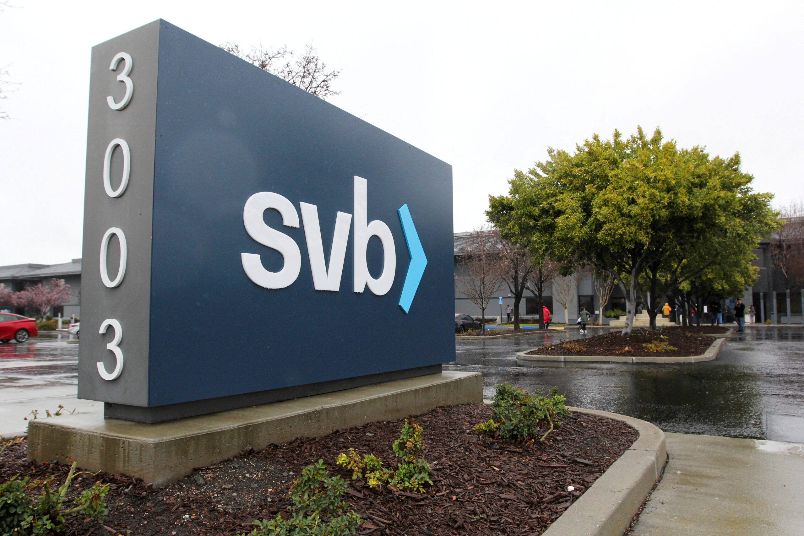 A sign for Silicon Valley Bank. The sign is blue with the bank's lower-cased "svb" logo.