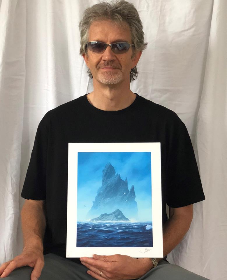 The artist, John Avon, with his iconic Island from Unstable