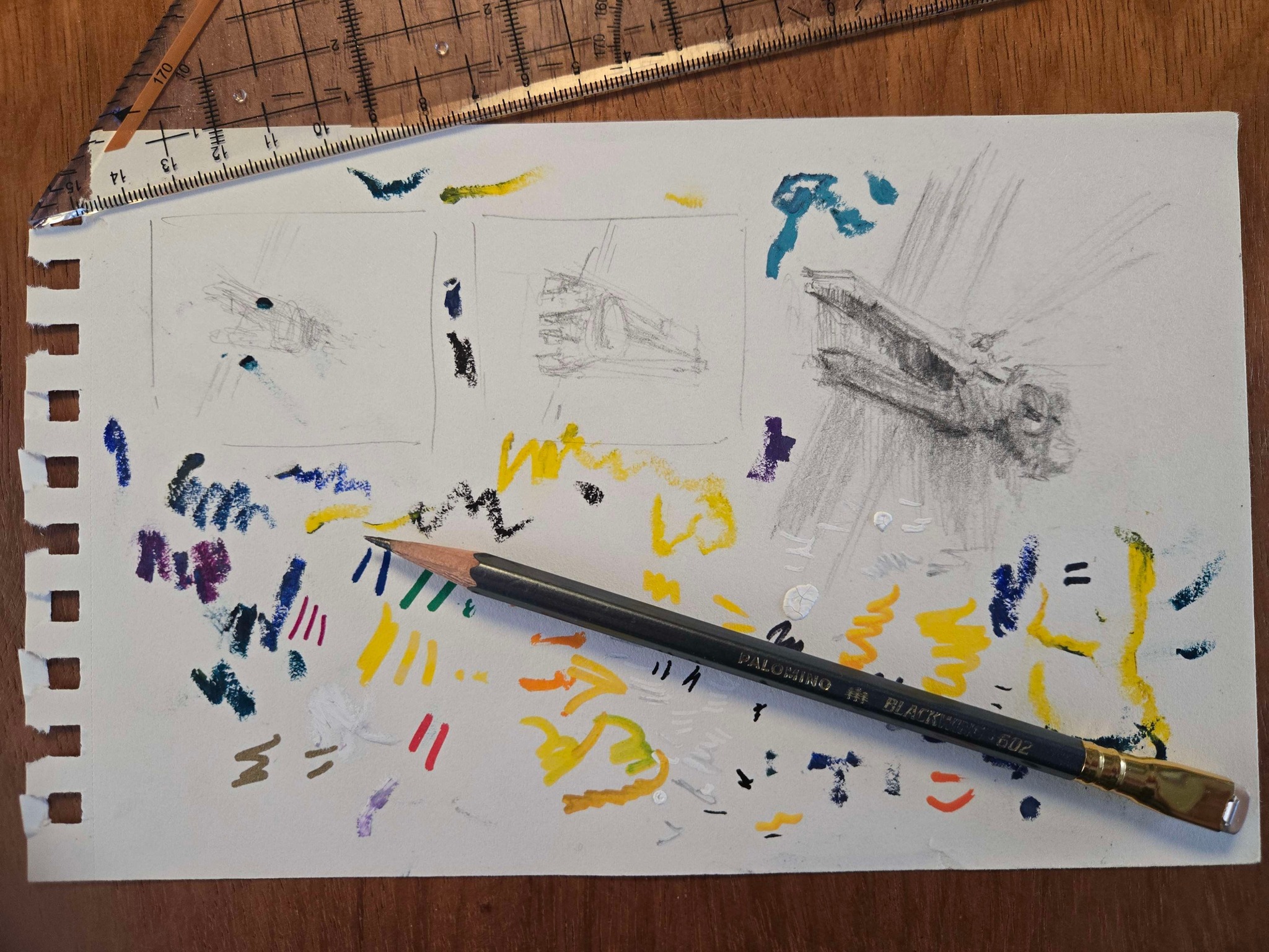 A tear off page from a sketch pad, featuring a sketch of a spaceship, along with many streaks of colored pencil and graphite.