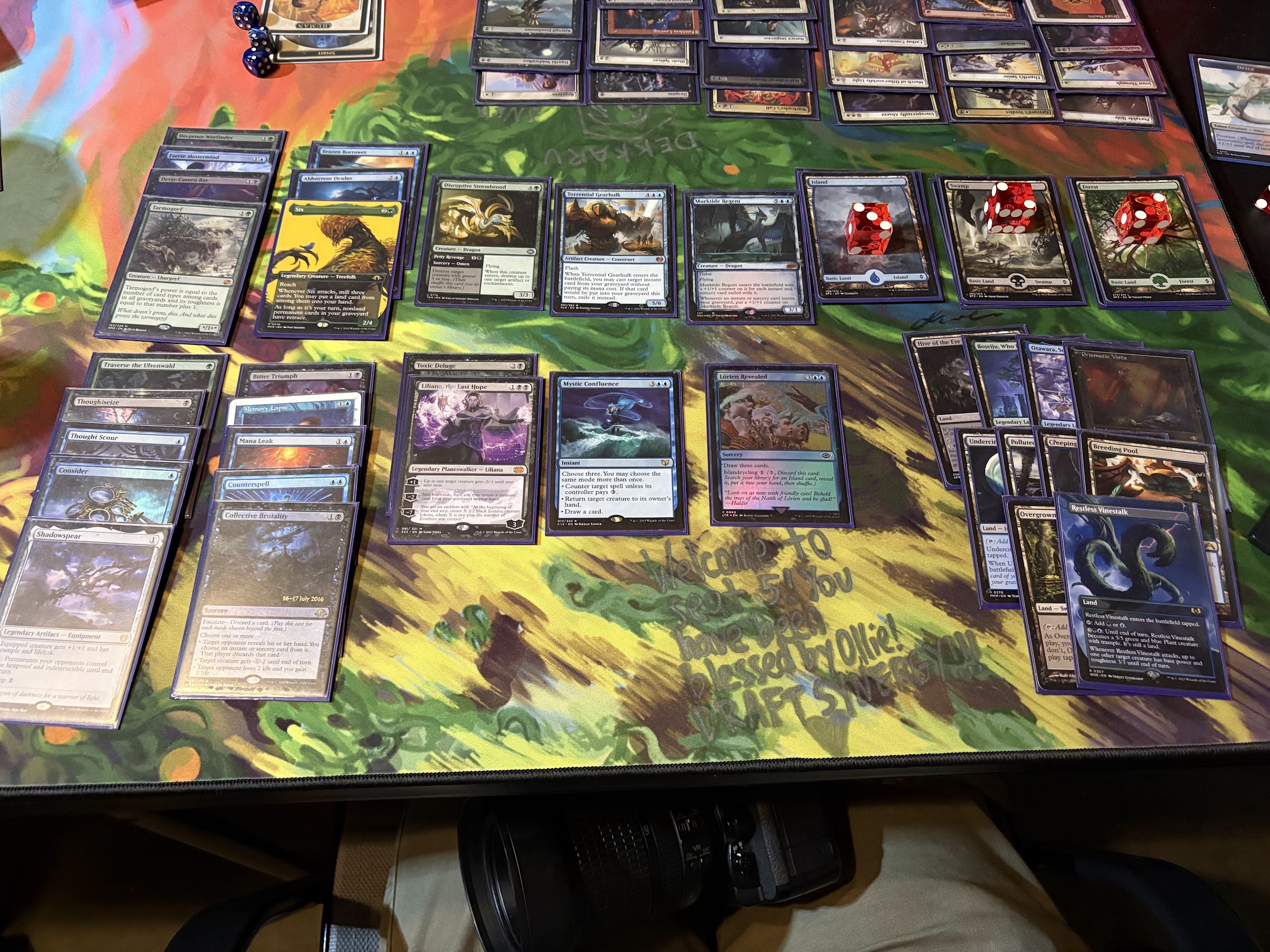 A draft deck of Magic cards, featuring blue, black, and green midrange cards
