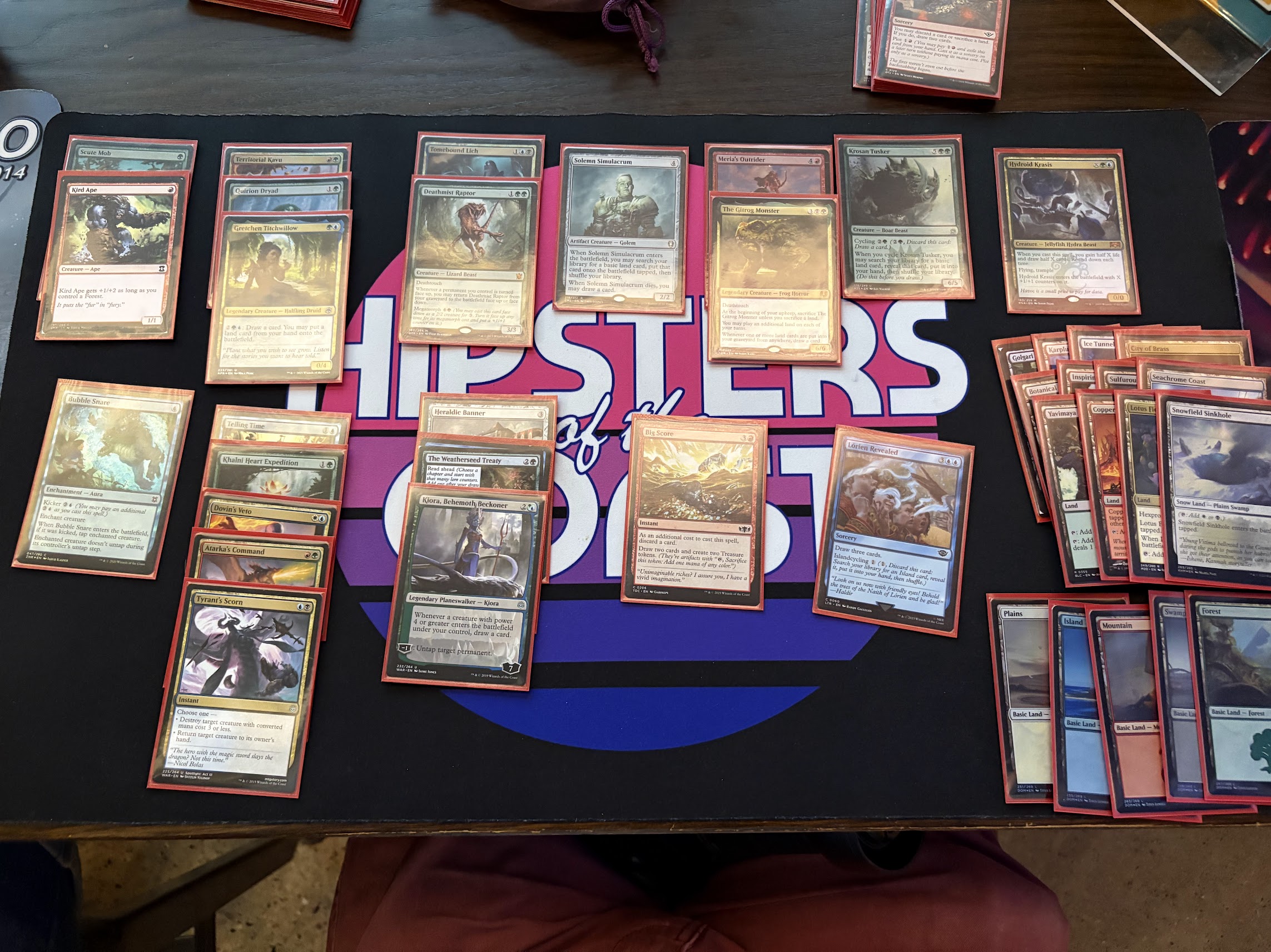 A draft deck of Magic cards, featuring five colors and all kinds of disparate cards working together in a five color deck